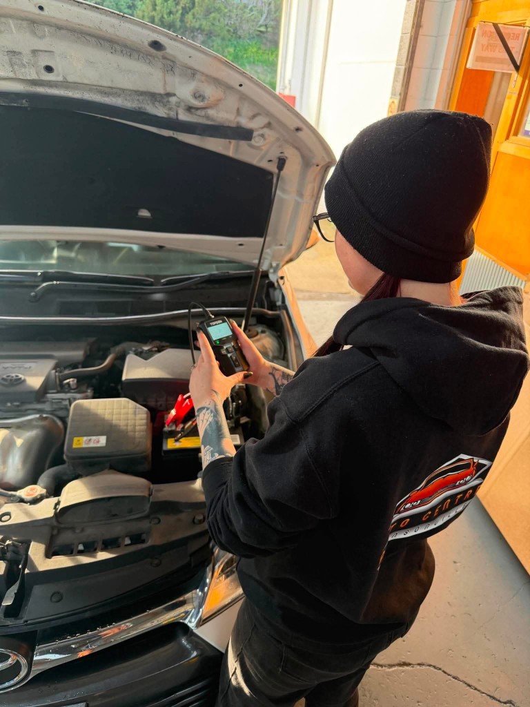 Technician running a battery diagnostic on a customer's Toyota