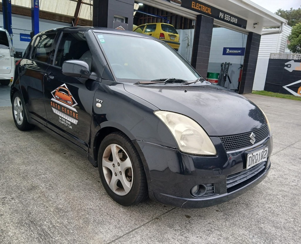 Auto Centre Johnsonville courtesy car parked in front of the workshop