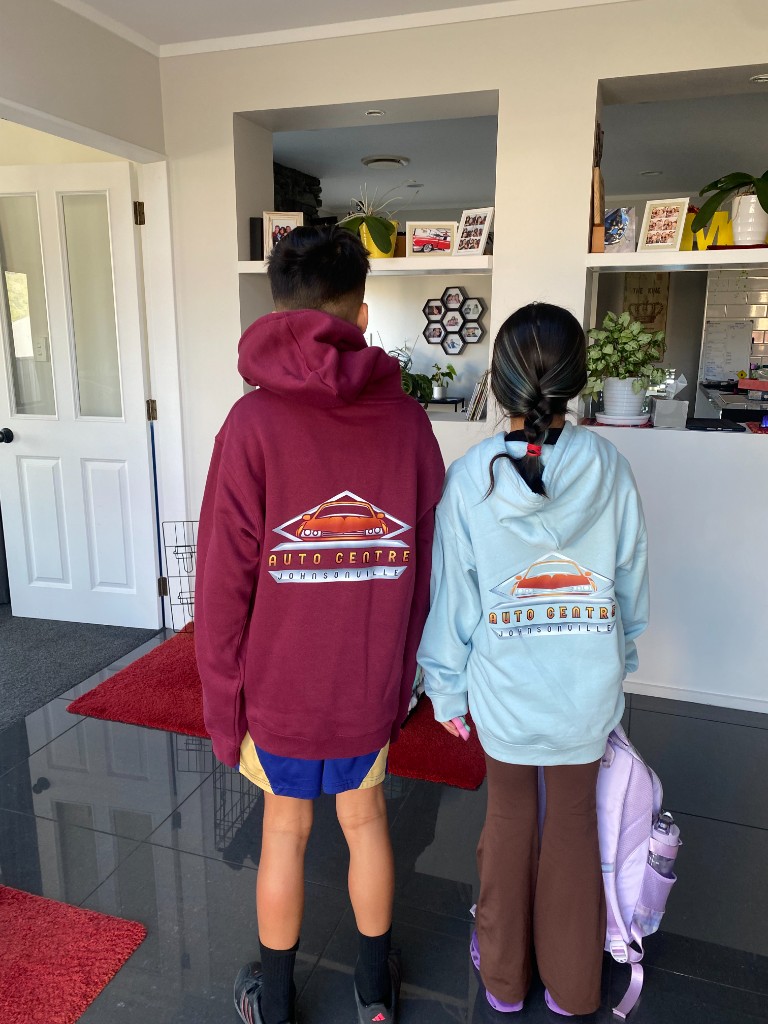 Claudio and Alecia's children wearing Auto Centre Johnsonville hoodies