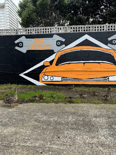 WOF and servicing mural outside Auto Centre Johnsonville with local ducks